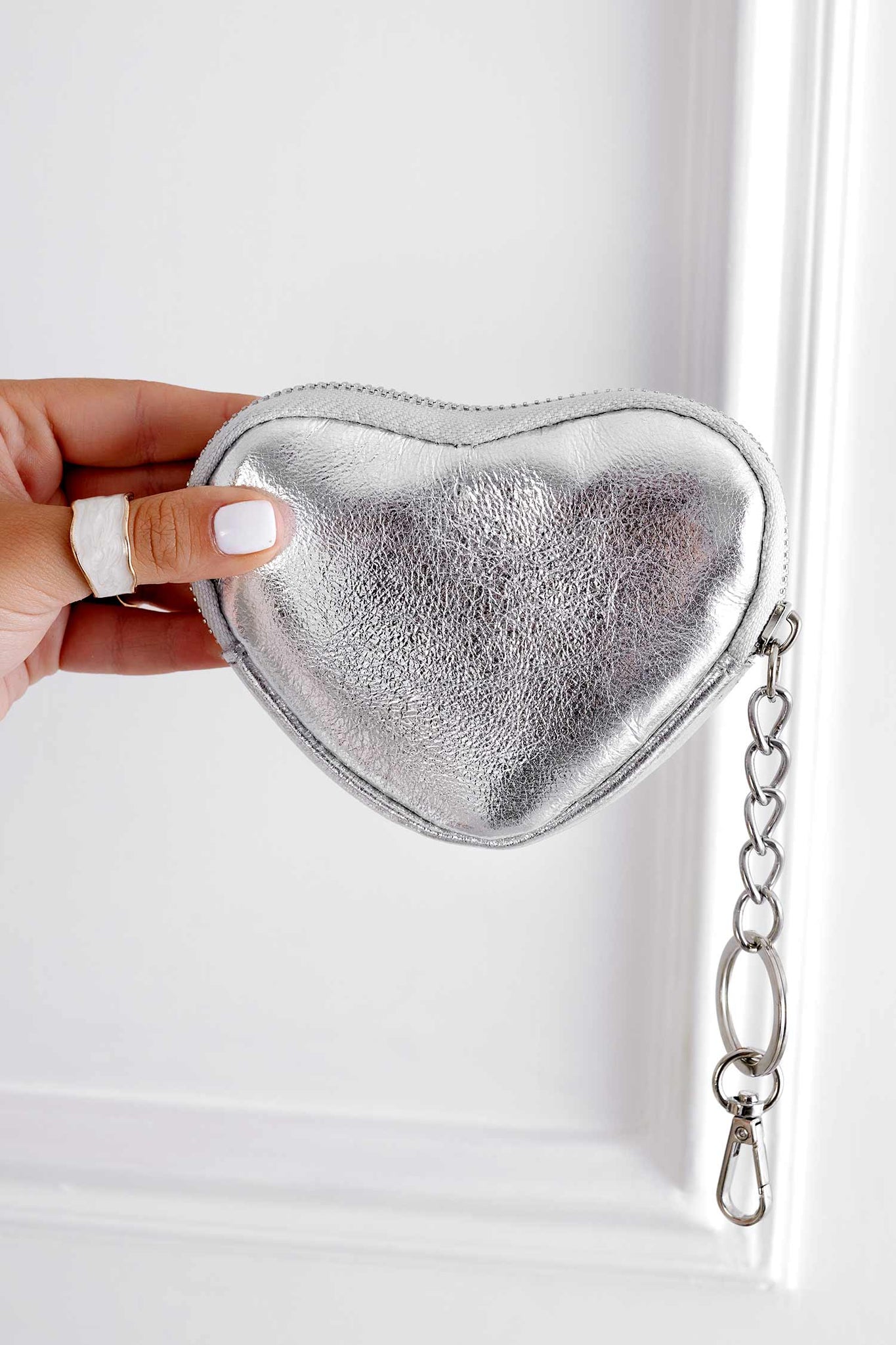 Metallic silver heart-shaped coin purse with zipper