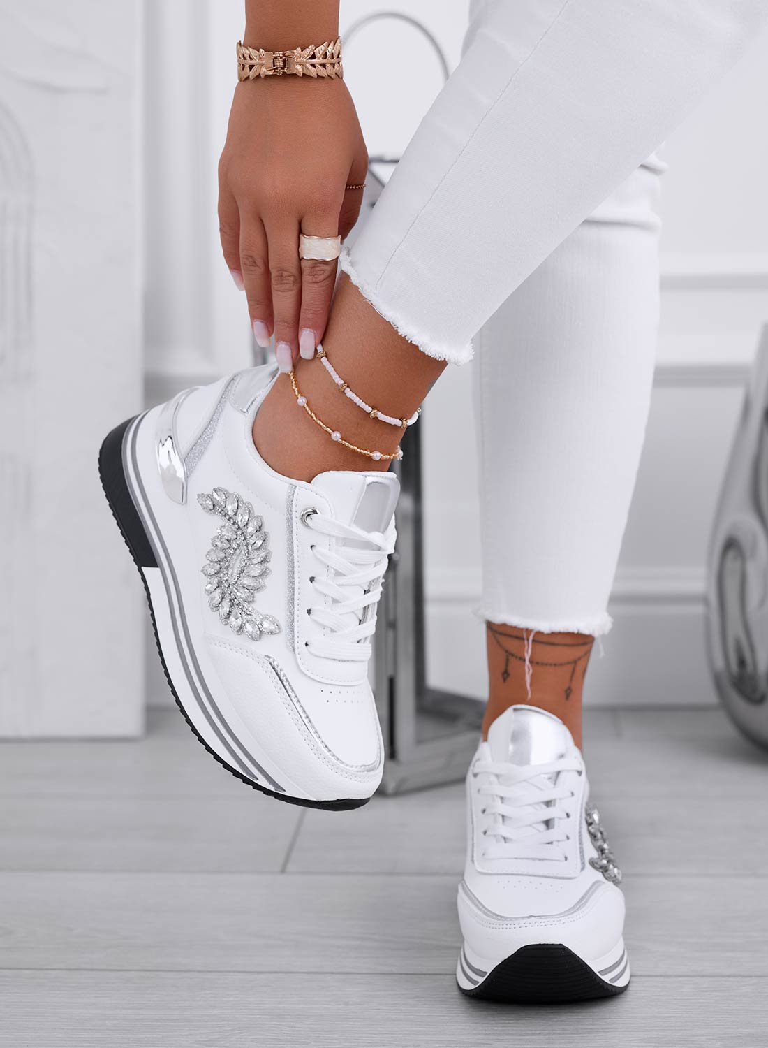 White sneakers with silver jewel embellishment
