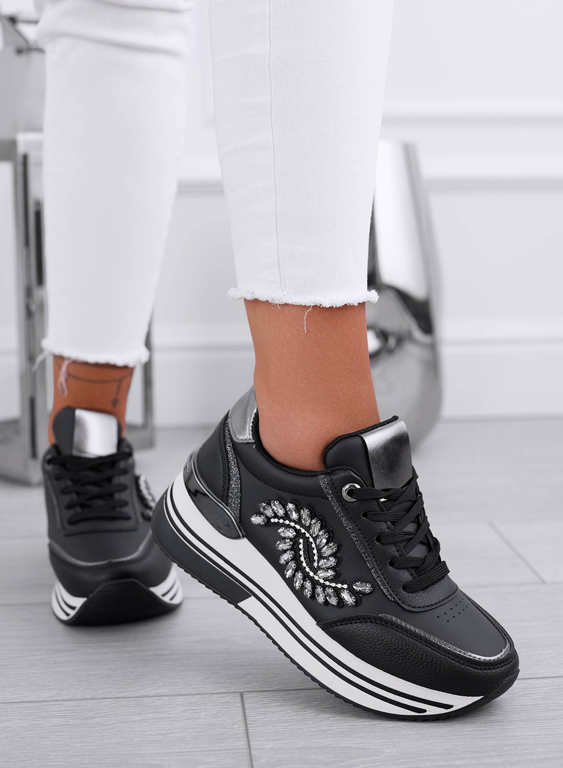 Black sneakers with silver jewel embellishment