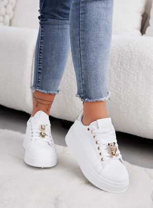 White sneakers with jewel applications and gold teddy