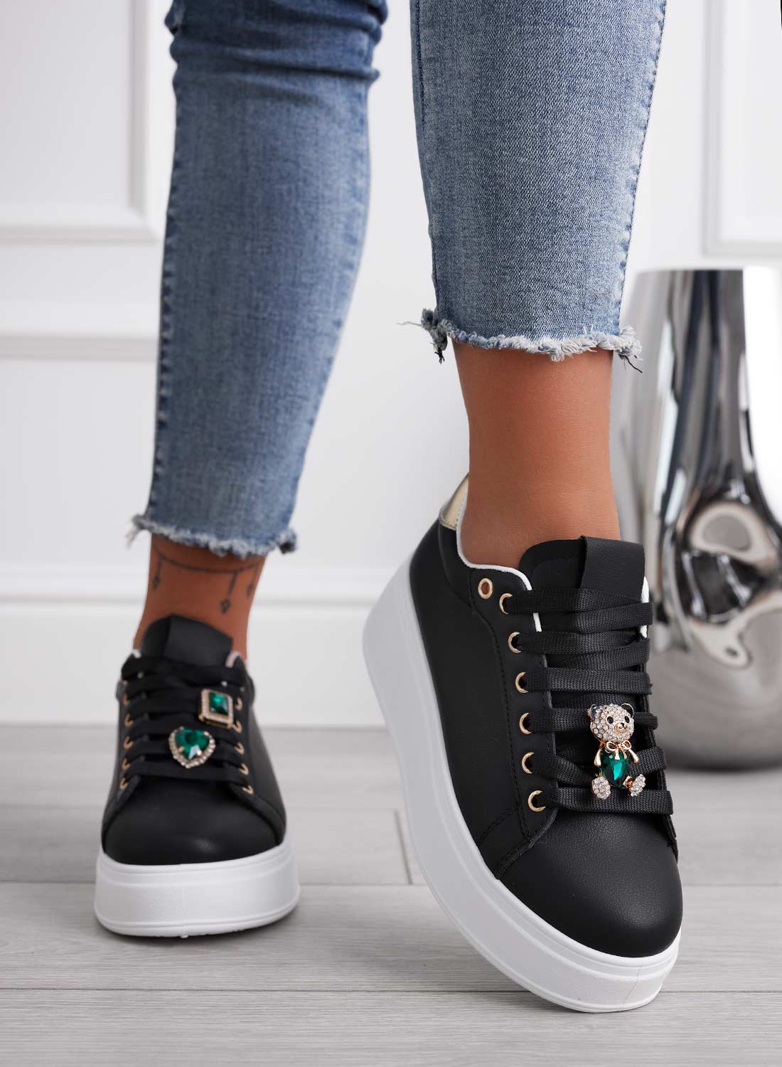Black sneakers with gold heel and green jewel teddy bear