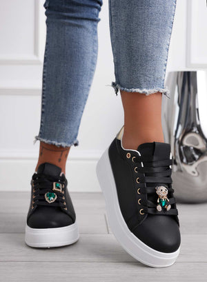 Black sneakers with gold heel and green jewel teddy bear