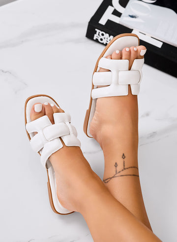 White sandals with H-shaped braided strap slides
