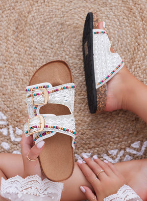 White slide sandals with rhinestones and multicolor beads