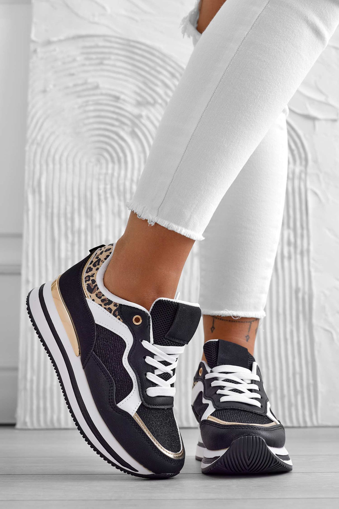 Black sneakers with animal print inserts