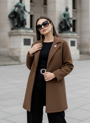 Brown coat with black button and brooch