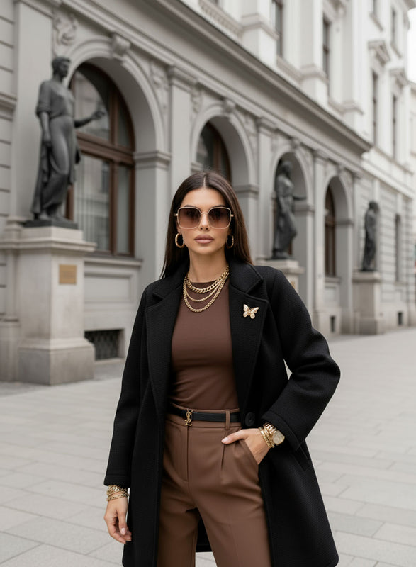 Black coat with black button and brooch