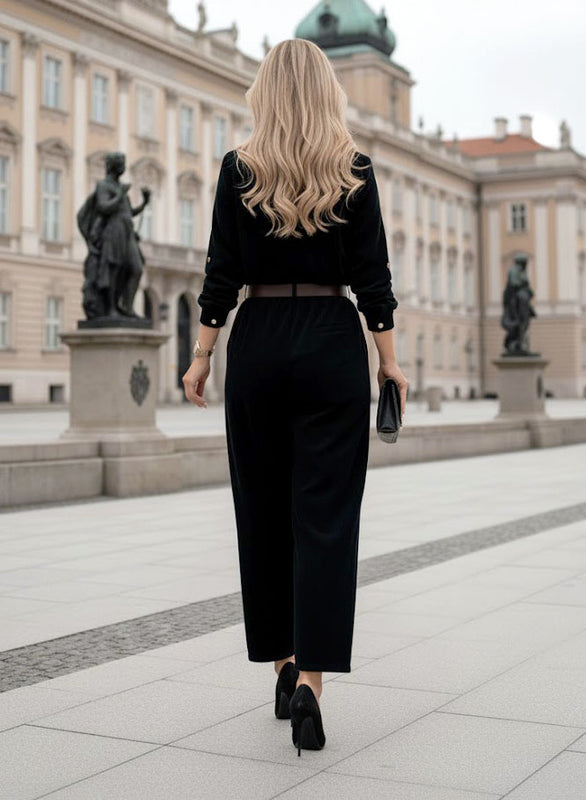 Tuta nera a costine con cintura