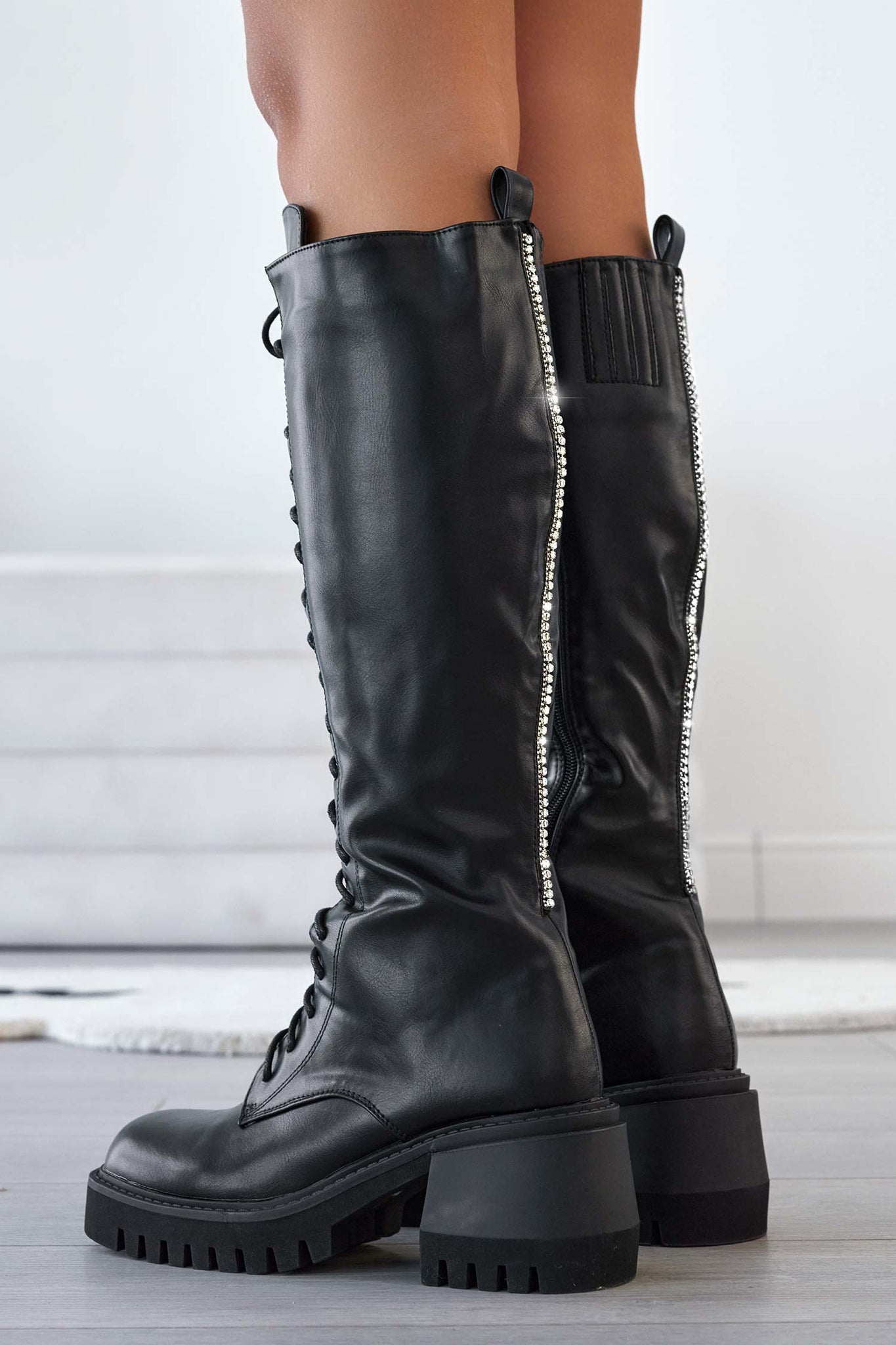 Alexoo black combat boots with laces and rhinestones on the back