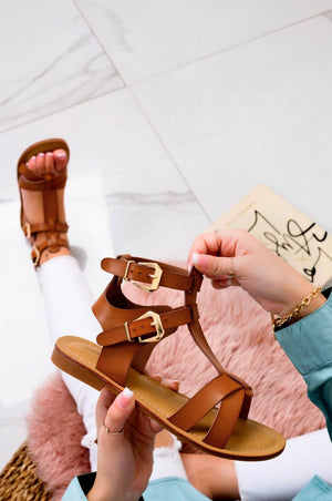 White low sandals with gold buckles