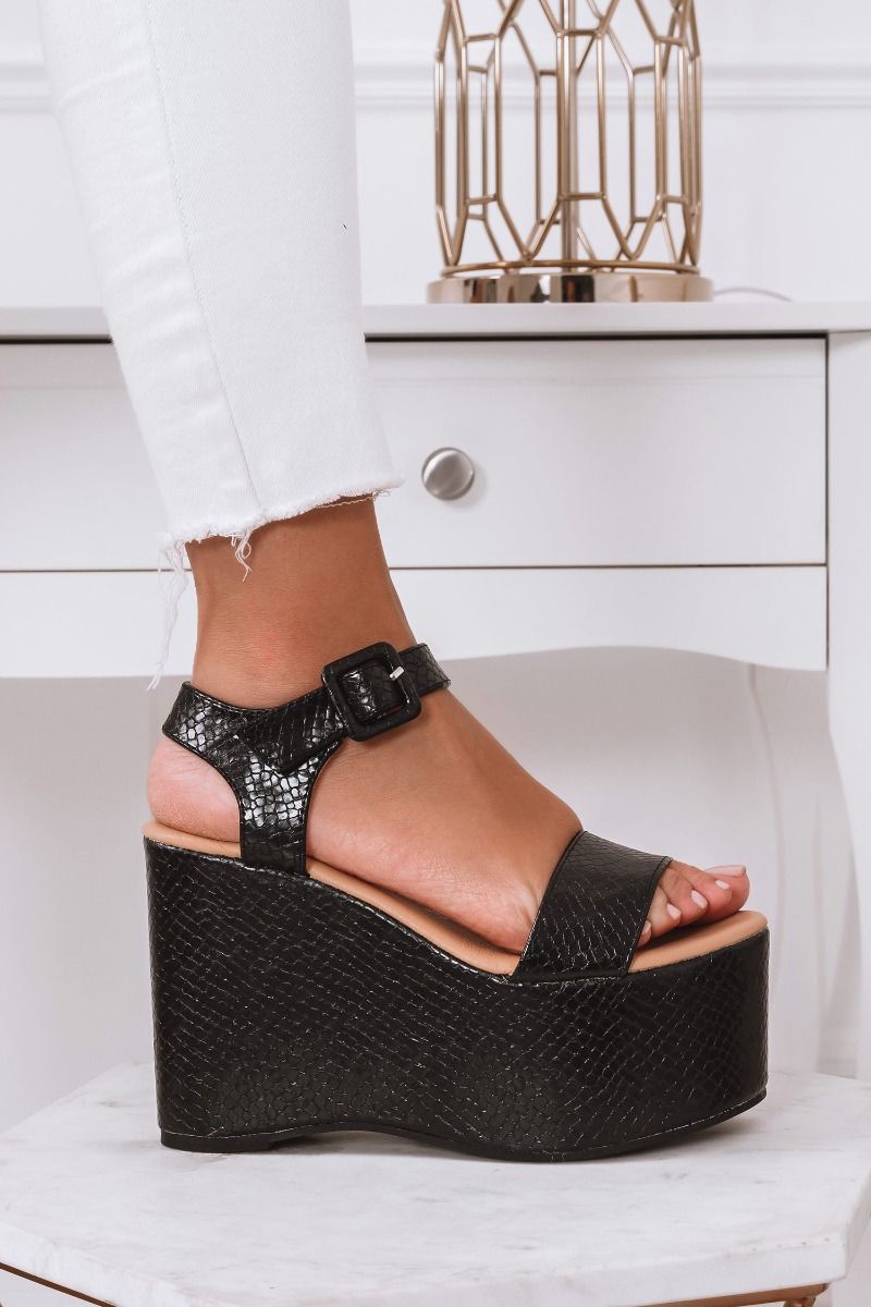 Black python-effect sandals with platform wedge