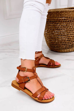 White low sandals with gold buckles