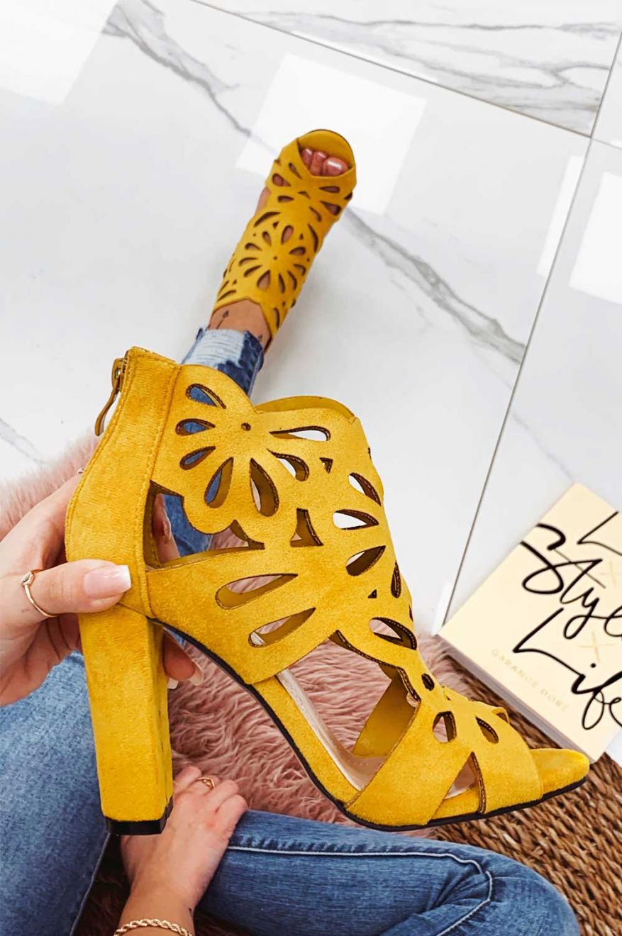 Yellow perforated sandals with comfortable heel