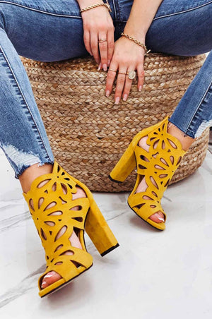 Yellow perforated sandals with comfortable heel