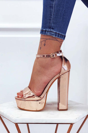 Rose gold patent sandals with high heel and ankle strap