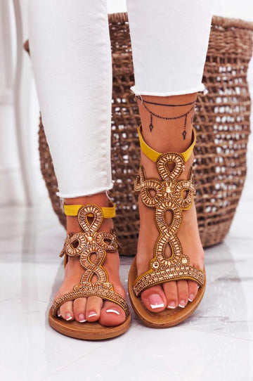 Low yellow jeweled sandals with rhinestones