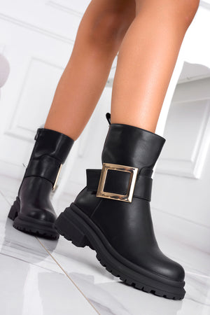 Black ankle boots with gold buckle