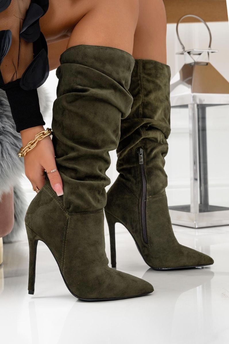 Green ruched ankle boots at calf height