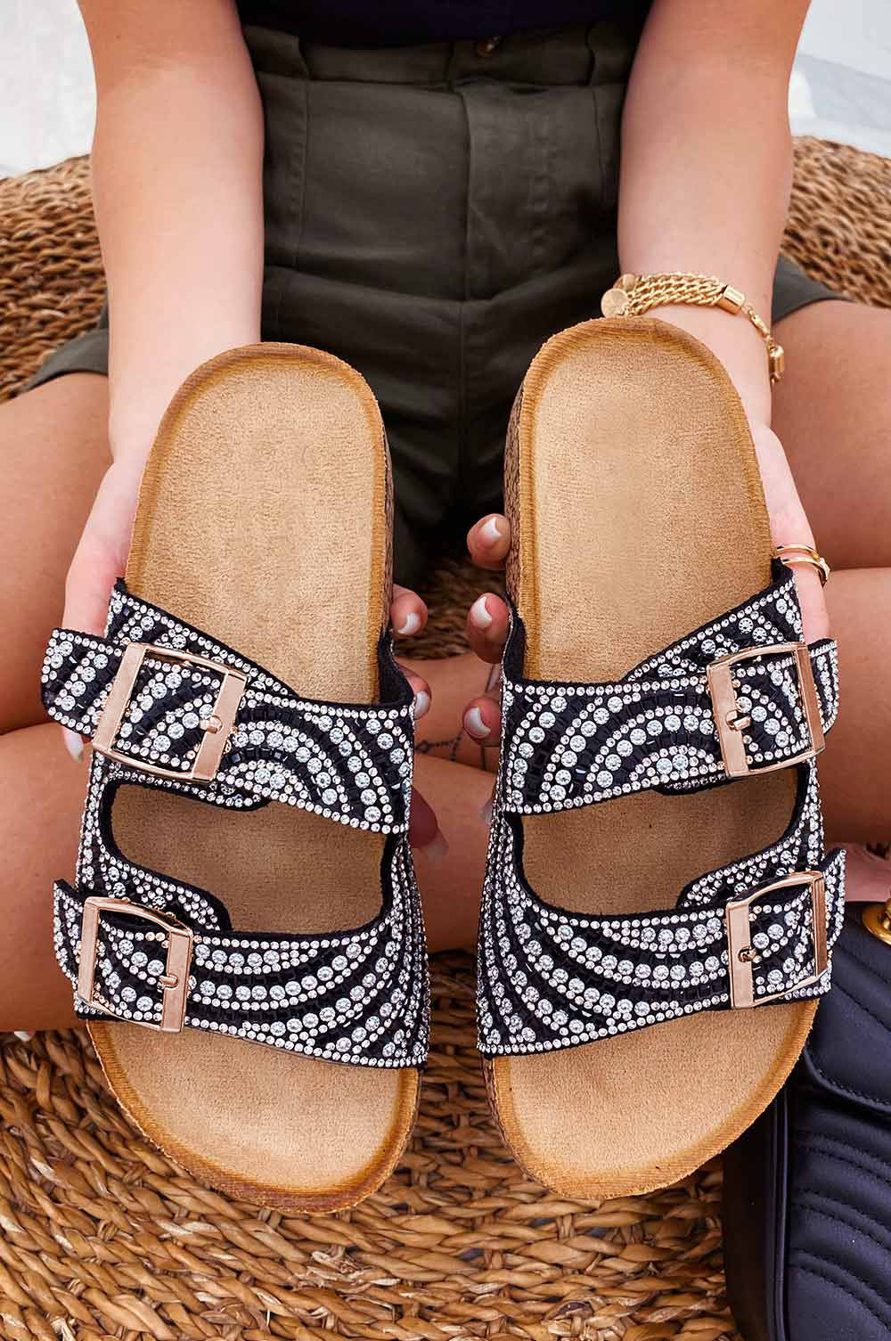 Black slide sandals with buckles and rhinestones