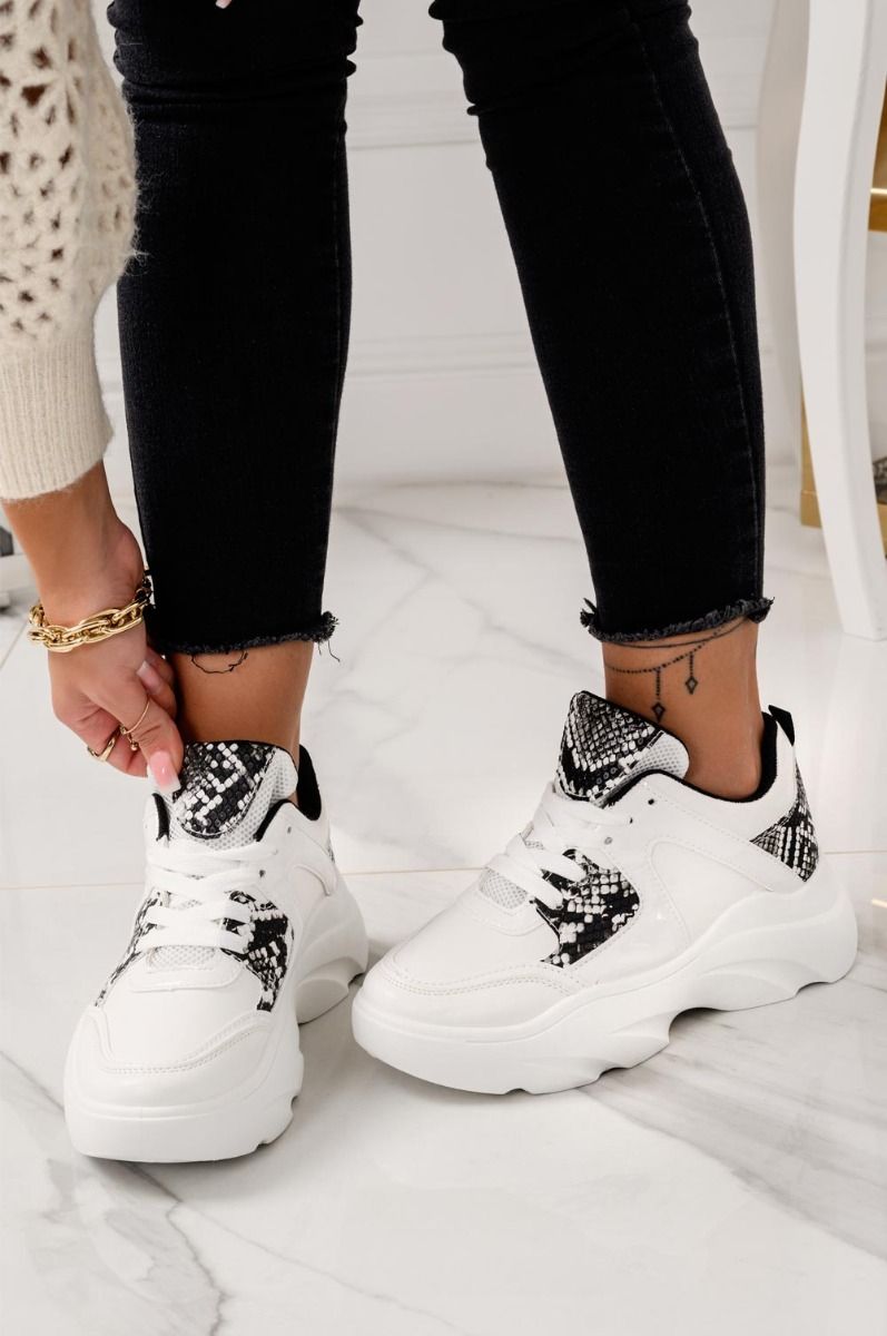 White sneakers with python-effect inserts and laces