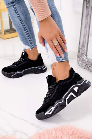 Black suede sneakers with thick sole and laces