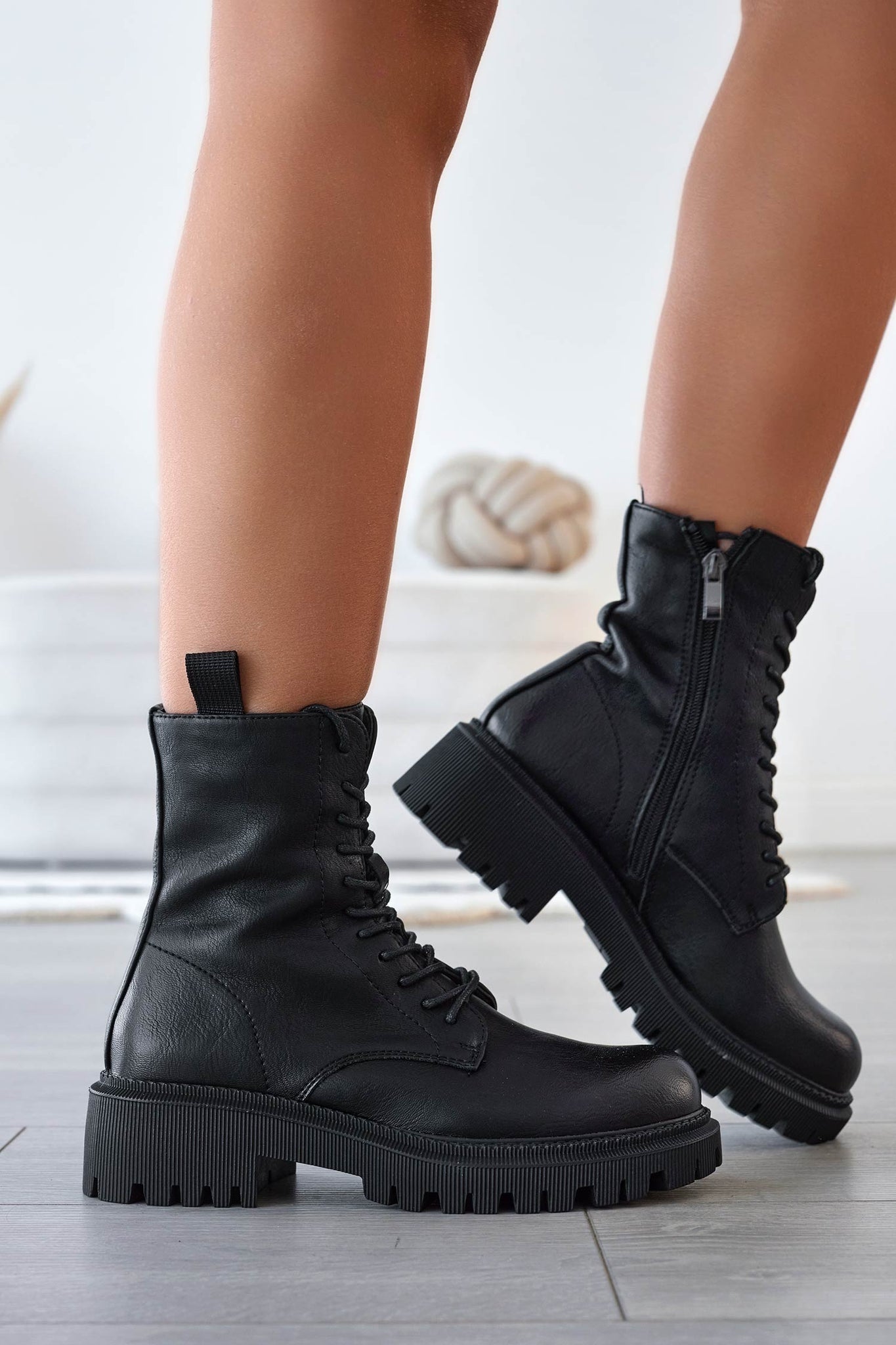 Black lace-up combat ankle boots