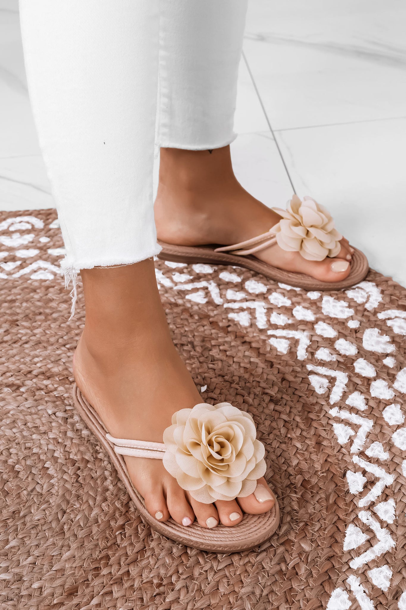 Beige slide sandals with applied flower