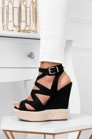 Black wrapped sandals with wedge heel