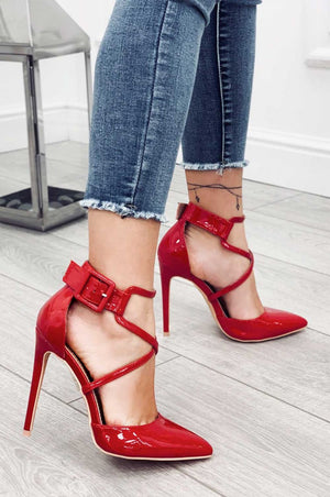 Red patent leather pumps with stiletto heel and buckle