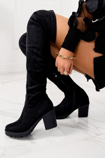 Black suede over-the-knee boots with comfortable heel