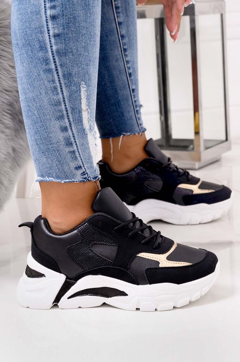 Black sneakers with thick sole and gold inserts