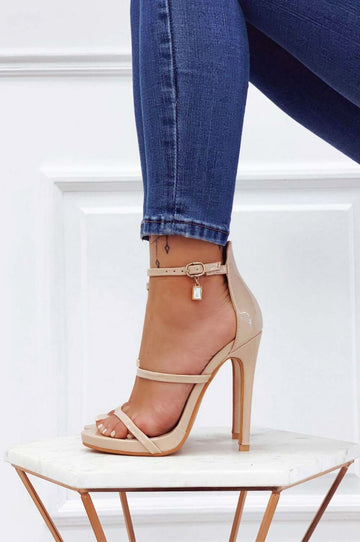 Beige patent leather sandals with high heel and jewel pendant