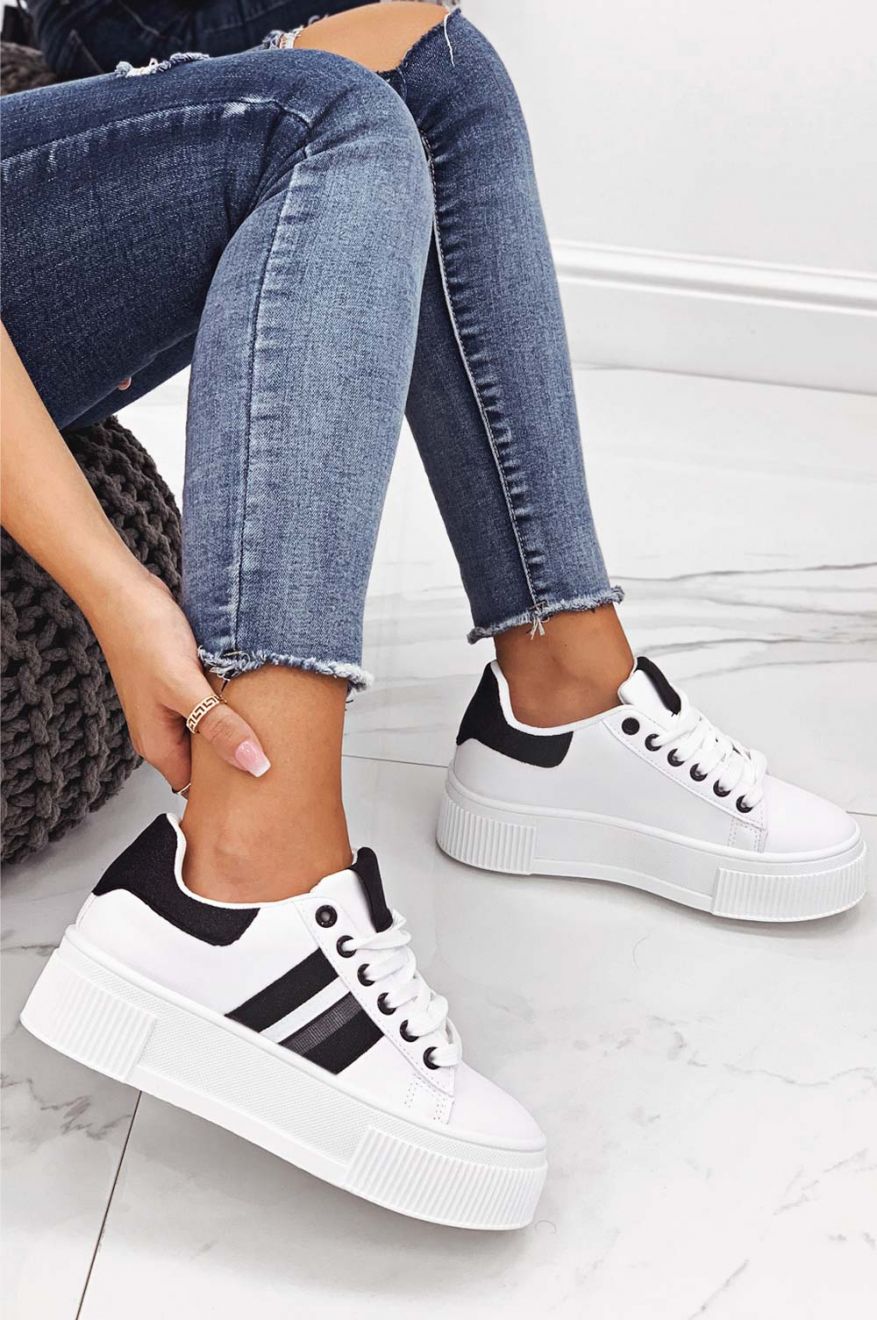 White sneakers with laces and black glitter inserts
