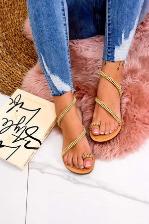 Low camel flip-flop sandals with gold embellishments