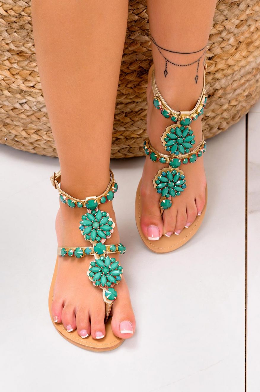 Low gold jeweled thong sandals with green stones