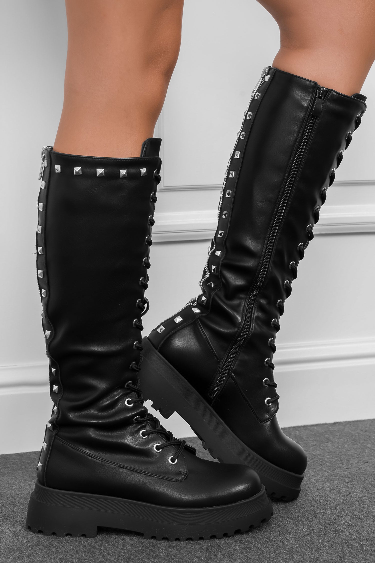 Black combat boots with studs and back zipper