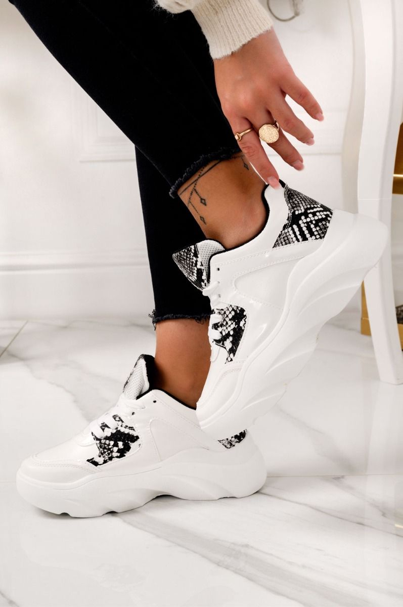 White sneakers with python-effect inserts and laces
