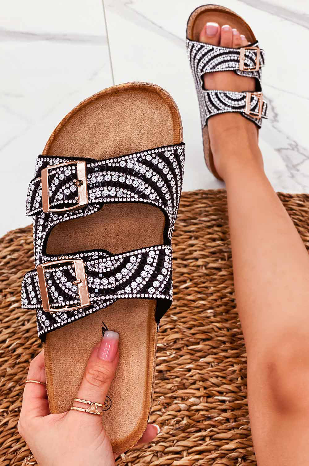 Black slide sandals with buckles and rhinestones
