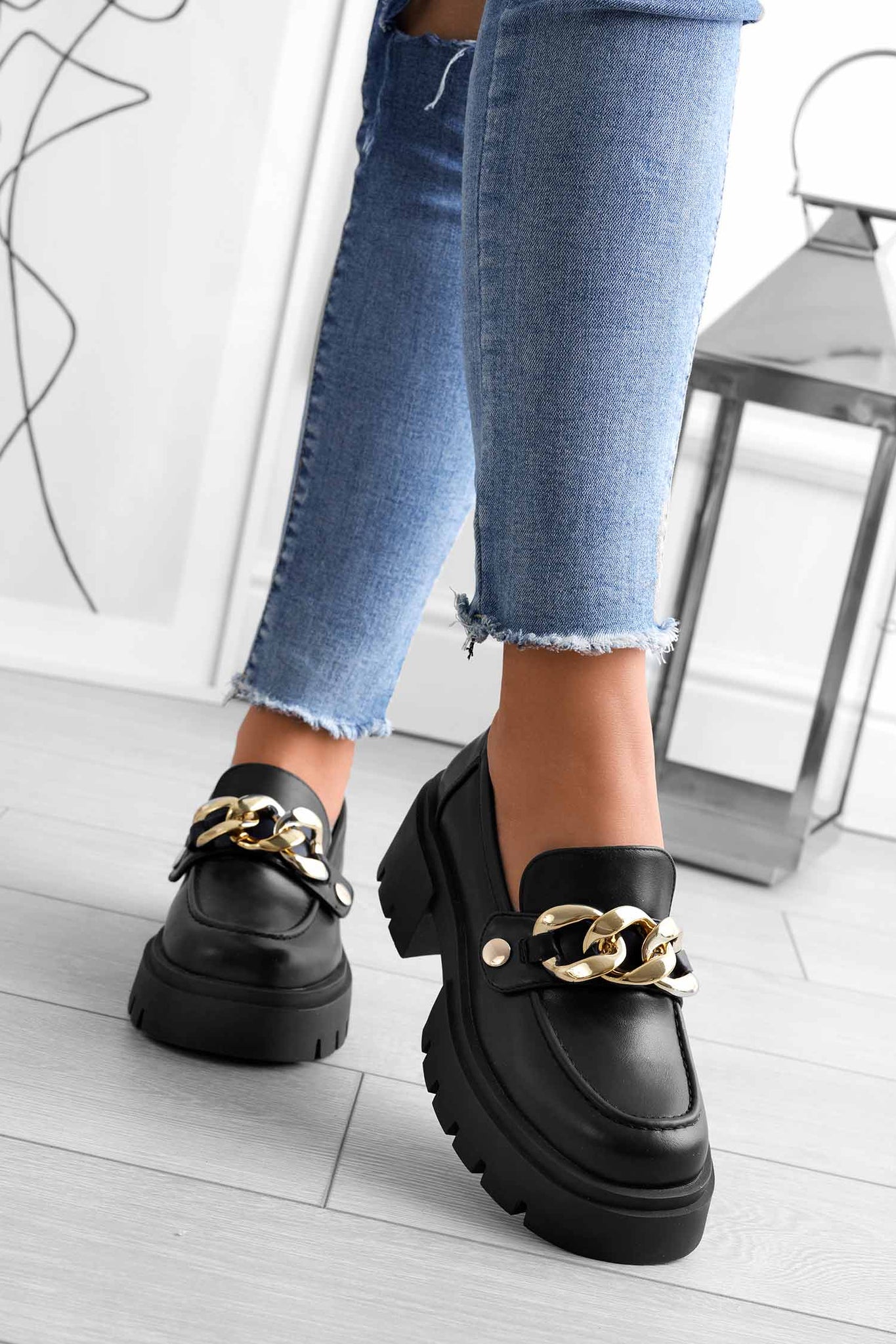 Black Alexoo platform loafers with interchangeable accessories