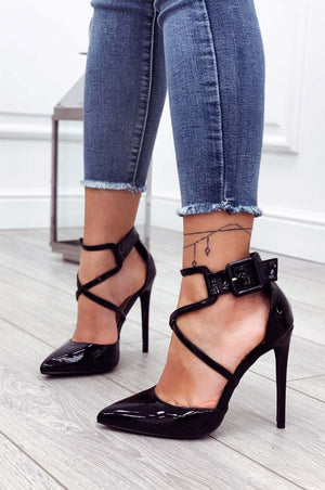 Black patent leather pumps with stiletto heel and buckle