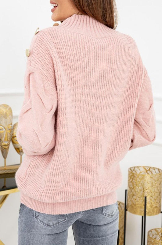 Maglione rosa con bottoni oro e maniche ad intreccio