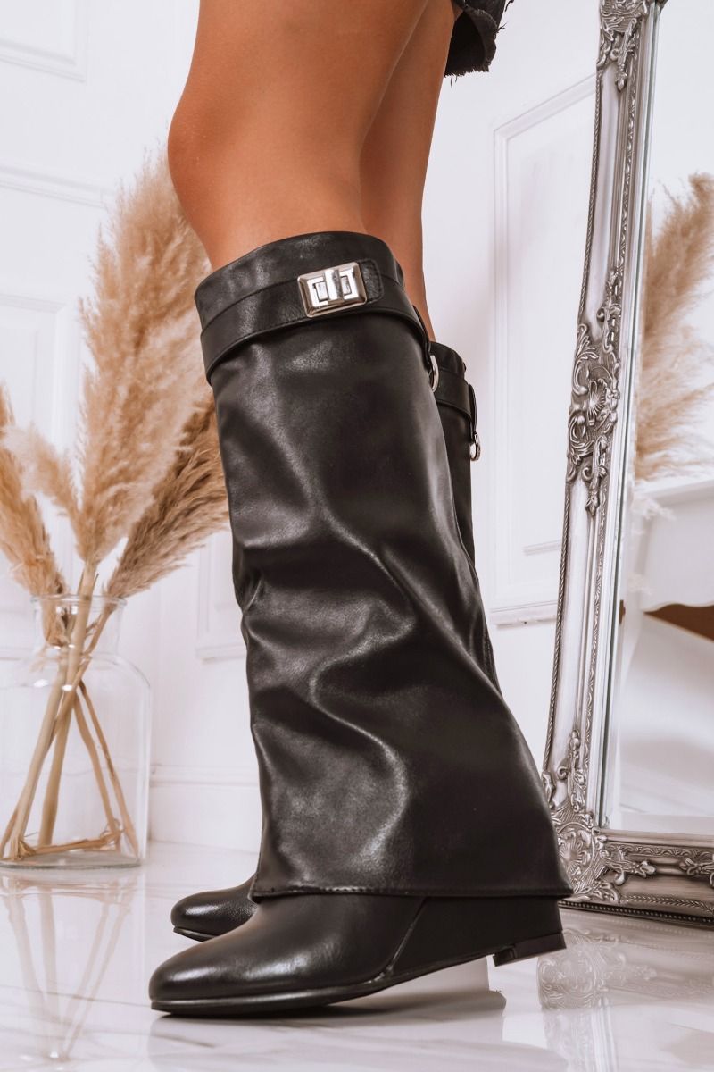 Bottes noires à semelle compensée et revers