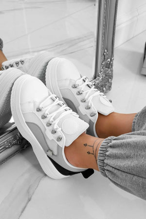 White sneakers with contrasting panels and silver hooks