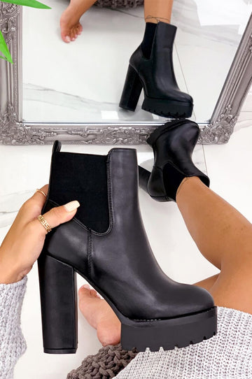 Black ankle boots with high heel and side elastic