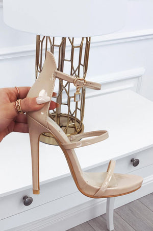 Beige patent leather sandals with high heel and jewel pendant