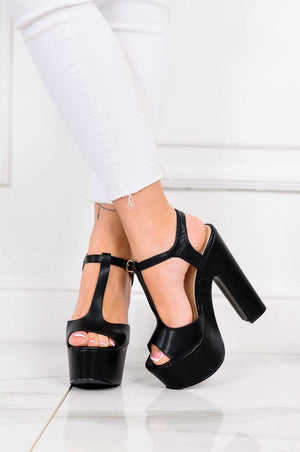 Black sandals with block heel and T-strap closure