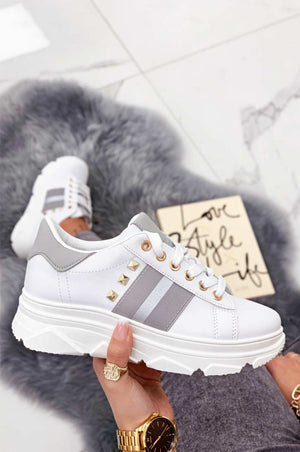 White sneakers with studs and silver inserts