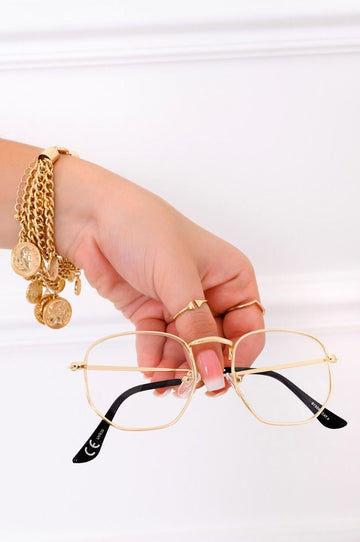 Glasses with clear lenses and gold frame