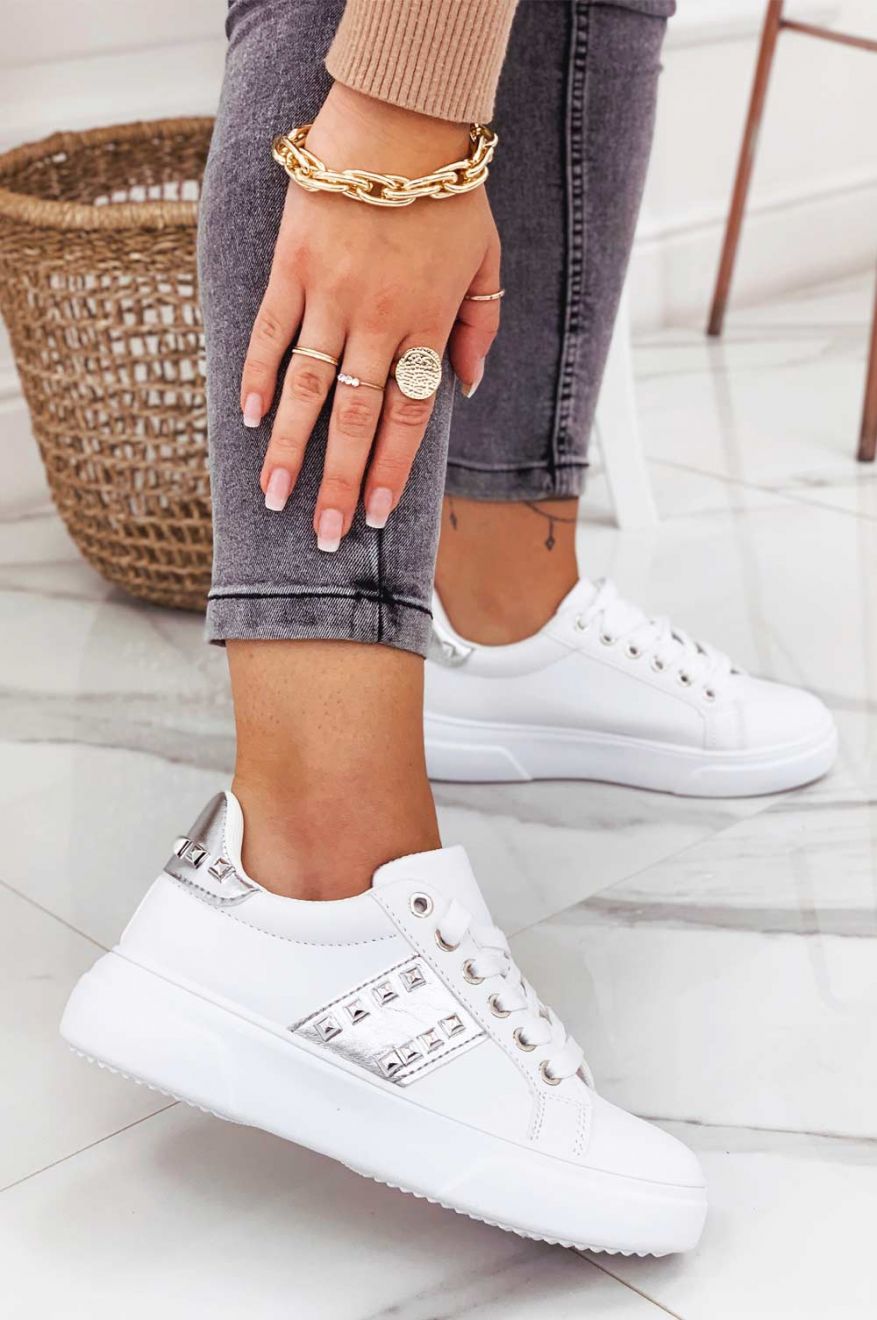 White sneakers with silver inserts and studs