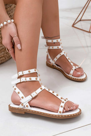 White flat sandals with gold sphere studs